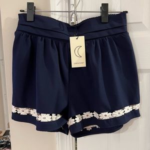 Navy blue shorts with white flower trim